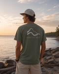 Man wearing a 'Soul to Salt' t-shirt by the water at sunset